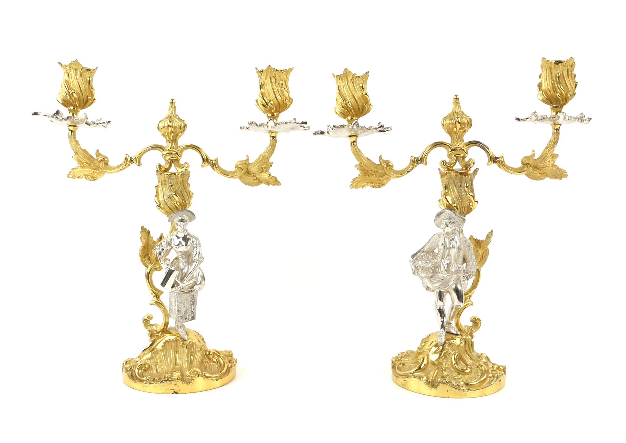 A pair of Mappin and Webb Rococo style silver gilt 2 branch figural candelabra modelled as a woman