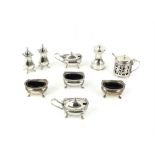 Modern silver six piece cruet set, comprising two mustards, two salts and two pepperettes,