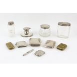 Silver capstan inkwell, three dressing table jars, two cigarette cases, two silver vesta cases,