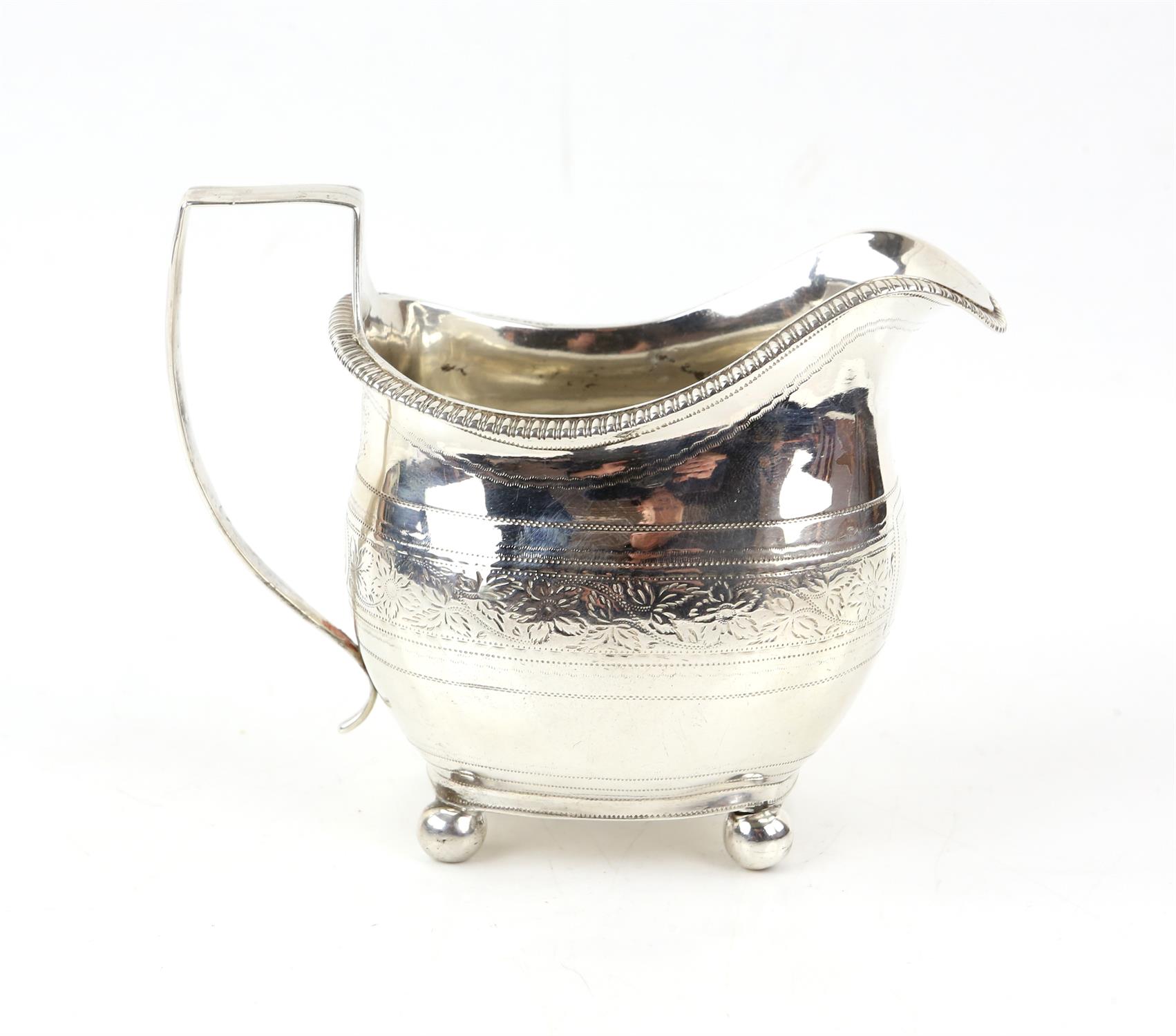 George III oval shaped silver cream jug with bright cut foliate scroll band, London 1811, - Image 3 of 3