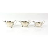 Pair of George VI silver sauceboats with serpentine rims on hoof feet, by Mappin & Webb, Sheffield,