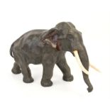 Cast bronze model of an African elephant, 38cm W 18cm D 23cm H