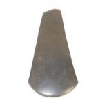 Papua New Guinea black stone axe head, 24cm high, 11cm wide Provenance: The vendor acquired these