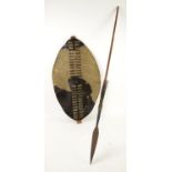 Late 19th / early 20th century Zulu hide shield of typical form and an Assagai spear,