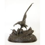 After Jules Moigniez, bronze figural group of an eagle defending its young, on naturalistic base,