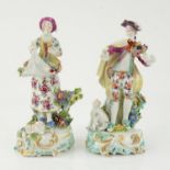 Pair of Derby style porcelain figures of a man holding a basket of fruit and a woman gathering