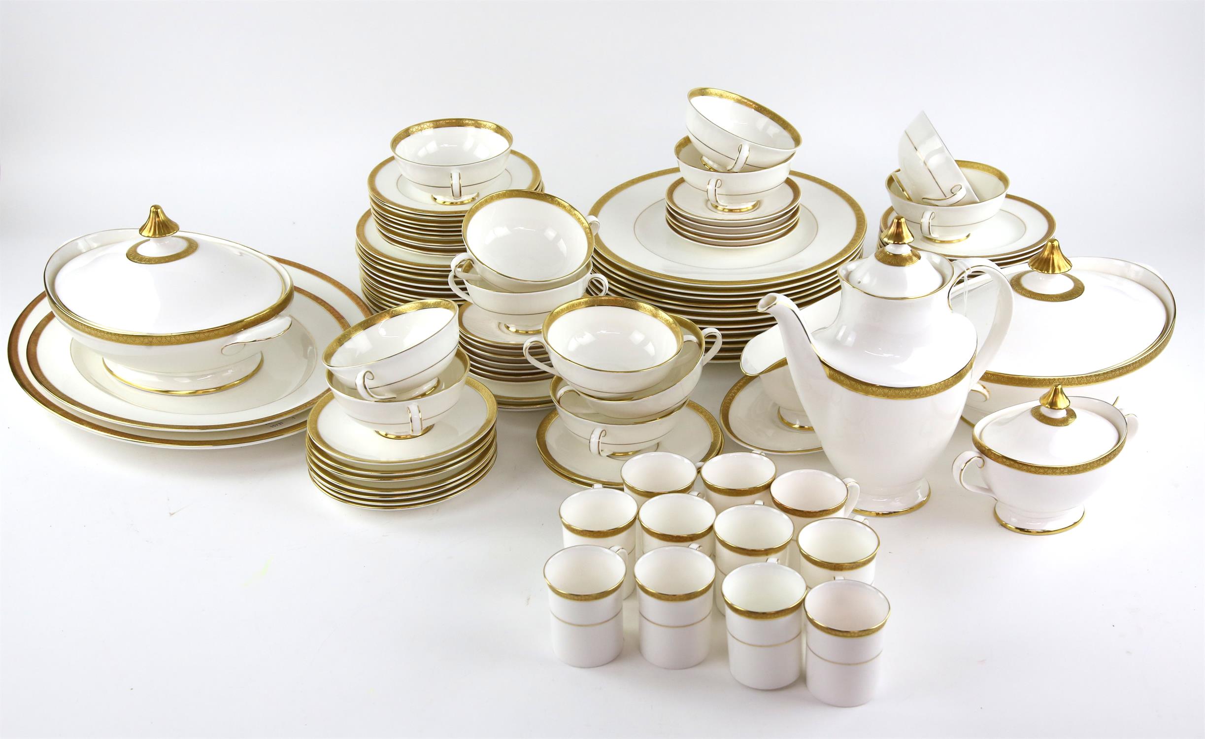 Royal Doulton 'Royal Gold' dinner service, decorated with a gilt border and band on a white ground,