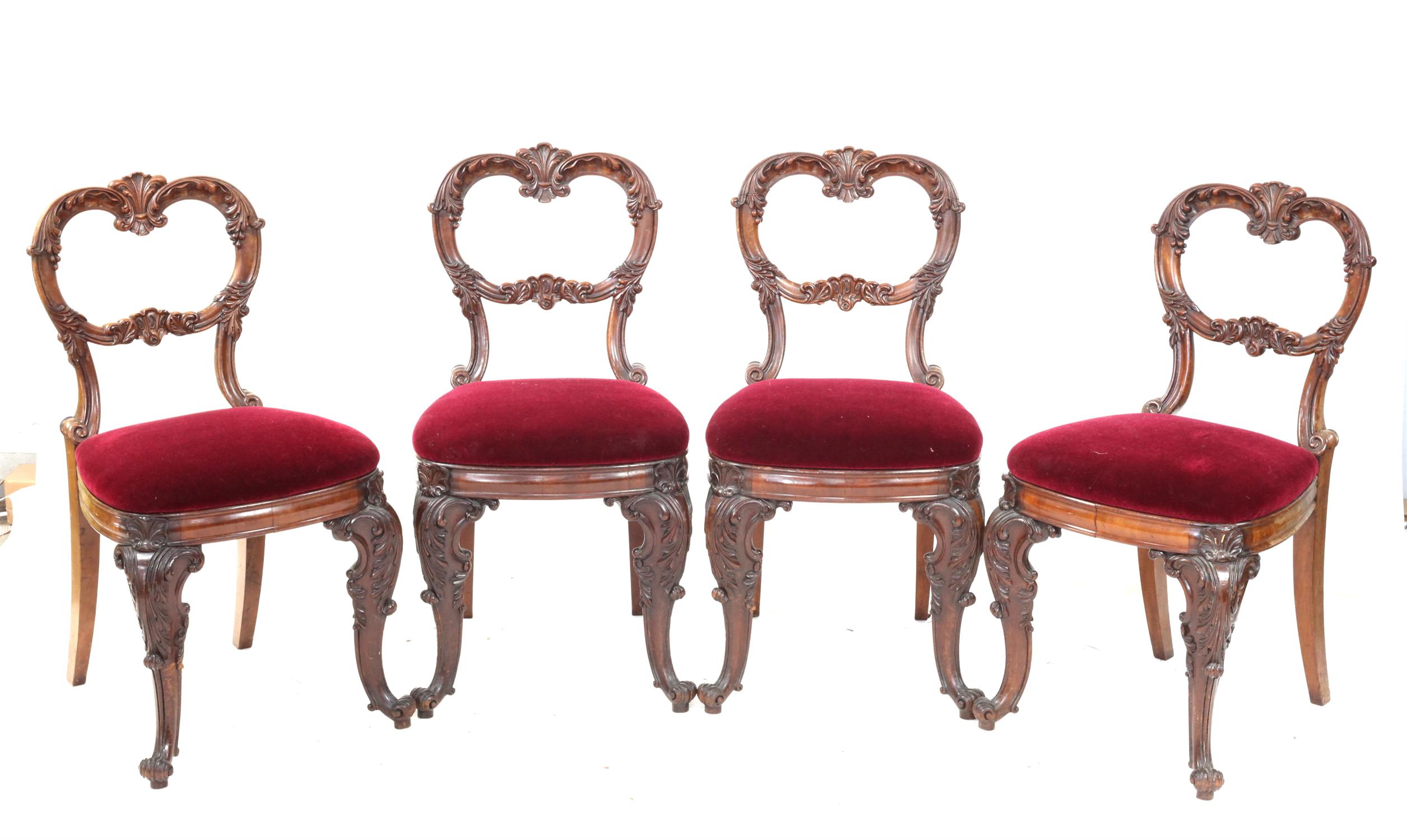 Set of four 19th century mahogany dining chairs, with carved backs and padded seats,