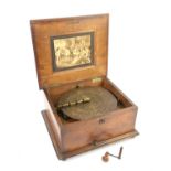 Victorian walnut and inlaid table top polyphon, the cover inlaid with a panel with flowers,