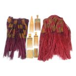 Papua New Guinea tribal items, to include two grass skirts, 37cm high, four wooden hair combs,