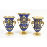 19th century porcelain urn vase in blue with gilded foliate decoration, twin handles,