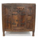 Indian reclaimed teak cupboard, with stylised floral and geometric carved decoration,