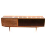 Archie Shine Hamilton teak sideboard, with glass top above four drawers and two cupboard doors on