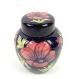 Moorcroft pottery ginger jar and cover, Anemone pattern on a dark blue ground, painted and