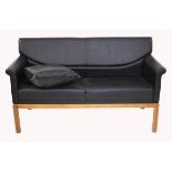 20th century walnut and black leather upholstered Harcourt range suite by Ben Dawson,