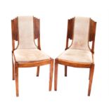 Six Art Decco "Skyscraper" side chairs with stepped backs on square tapering front supports,