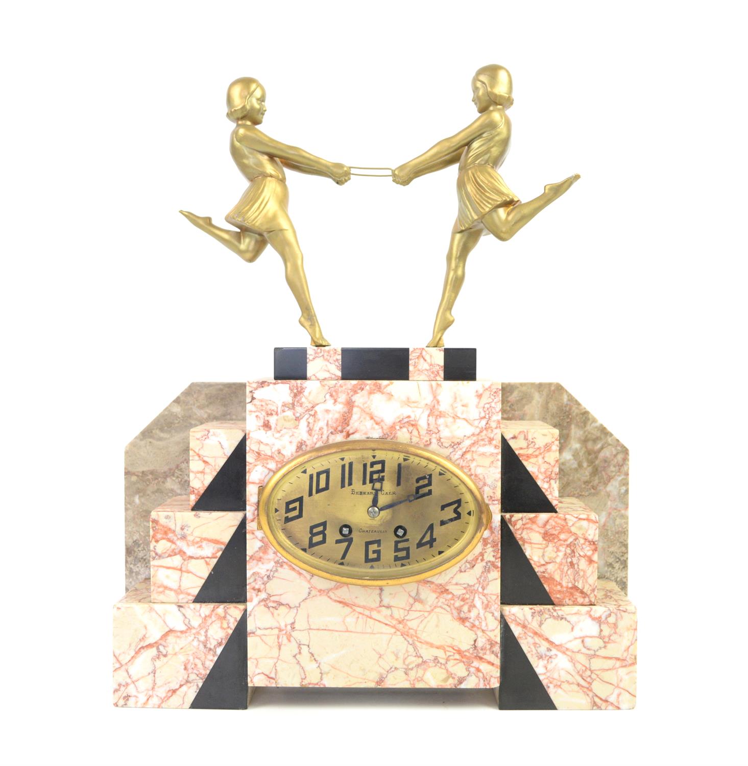 Art Deco clock mounted with a pair of gilt female figures holding a hoop, on stepped pink with