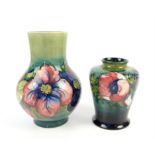 Moorcroft Clematis pattern vase of baluster form with blue green ground, painted green initials and