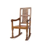 Robert 'Mouseman' Thompson of Kilburn, oak rocking chair with a double lattice back and tan leather