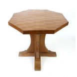 Robert 'Mouseman' Thompson of Kilburn octagonal oak table with adzed top on X-shaped base,