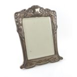 An Art Nouveau silver dressing table mirror by E Mander & Son, Birmingham 1902 with bevelled mirror