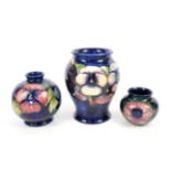 Moorcroft vase decorated in the Pansy pattern on a blue ground, green script initials,