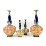 Pair of Royal Doulton Slaters Patent stoneware vases, with blue glazed elongated necks and typical