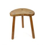 Robert 'Mouseman' Thompson of Kilburn oak three-legged stool with adzed seat, h46 x w36.5 x d28cm,
