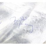 Queen - Radio Ga Ga - A white paper three piece suit signed by all four members of the band,