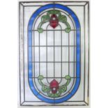 Glass panel in the style of a leaded glass window and a pair of reconstituted stone Temple lions