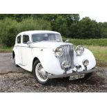 1939 Jaguar SS100 SE Saloon, White, 4-door with wire wheels.