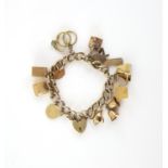 Vintage gold charm bracelet, curb links, with a heart padlock clasp and safety chain,