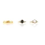 Three rings, including a 3.9mm wedding band in 22 ct yellow gold, size S, a bloodstone ring with