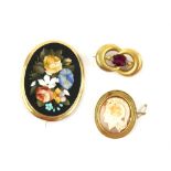 Pietra Dura floral brooch, featuring a floral motif including a forget-me-not, in a gold mount,