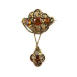 Victorian citrine drop brooch, designed as an ornate openwork brooch, set with three round cut