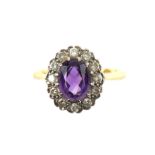 Amethyst and diamond cluster ring with central oval amethyst estimated size 1.76 carats,