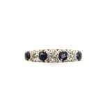 Sapphire and diamond half hoop ring, set with four round cut sapphires, spaced with three illusion