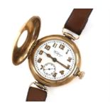 Waltham gold wrist watch, half hunter design, white enamel dial with Arabic numerals,