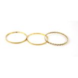 Two matching round gold faceted bangles, testing as 22 ct, internal diameter 5.9cm,