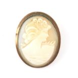 Cameo brooch, depicting the profile of a lady, in a tested 9 ct mount, with safety chain