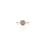 Contemporary diamond cluster ring, set with central square cushion cut yellow diamond,