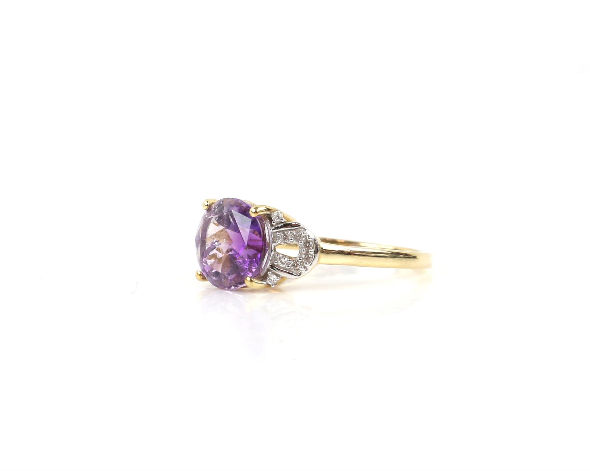 Amethyst ring, set with a round fancy cut amethyst with central star detail, with white zircon set - Image 2 of 5