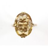 1960's oval cut citrine cocktail ring, estimated weight 9.11 carats, mount stamped 9 ct, ring size L