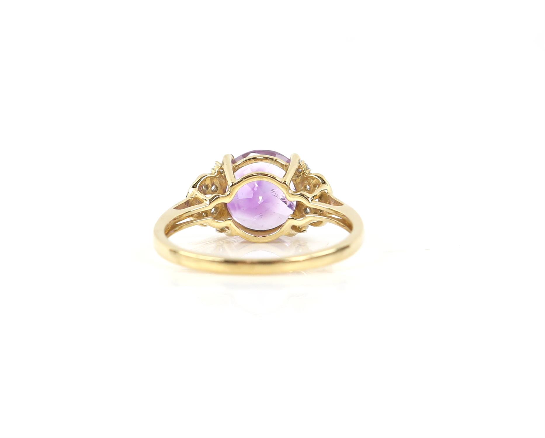 Amethyst ring, set with a round fancy cut amethyst with central star detail, with white zircon set - Image 3 of 5