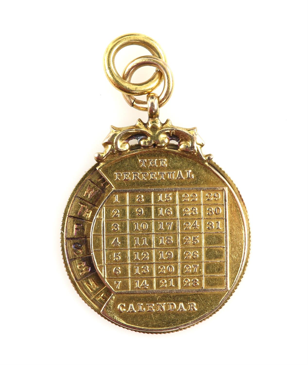 An unusual gold perpetual calendar pendant, ivy leaf engraved decoration, stamped 15 ct gold,