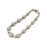 Diamond graduated floral bracelet, set with round brilliant cut diamonds, estimated total weight 2.