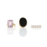 Three rings including, a rectangular cut amethyst ring in hallmarked 9 ct gold, size P,