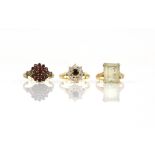 Three gem set vintage rings, including a single stone citrine ring, size K 1/2, a garnet cluster