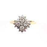 A diamond cluster ring, weighing an estimated total of 1.00 carat, mounted in 18 ct,
