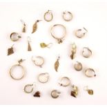 A group of thirteen pairs earrings, with seven pairs of hoops all in 9 ct gold, and five other 9 ct